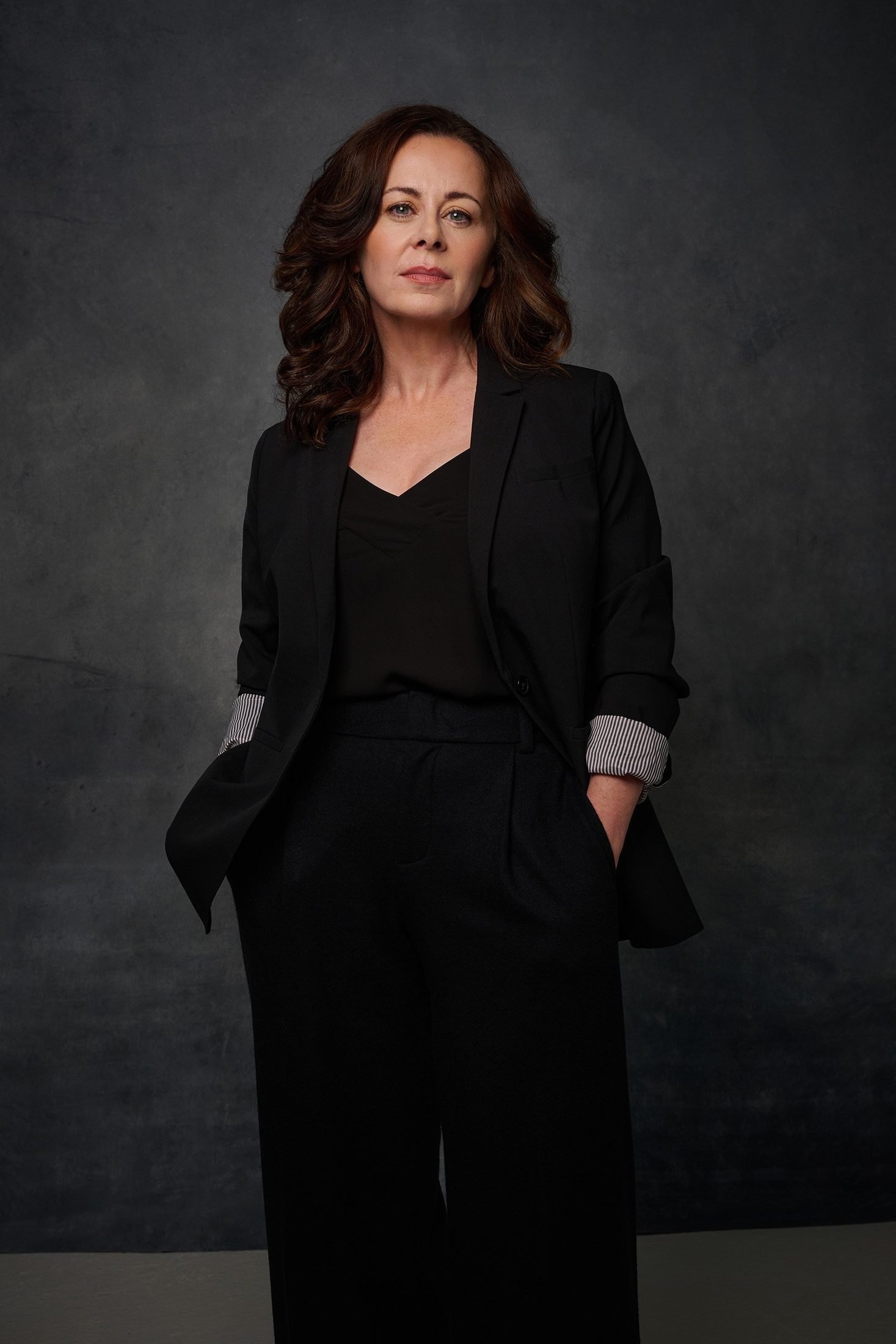 Executive portrait of a woman in a black blazer, typical of Capital Region corporate work